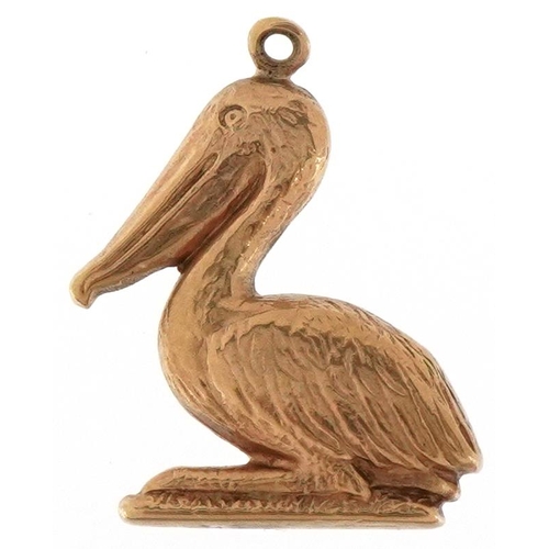 3228 - A 9ct gold charm in the form of a pelican, 1.9cm high, 0.7g.