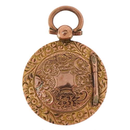 3220 - A Victorian floral engraved yellow metal locket, 3.3cm high, 5.4g.