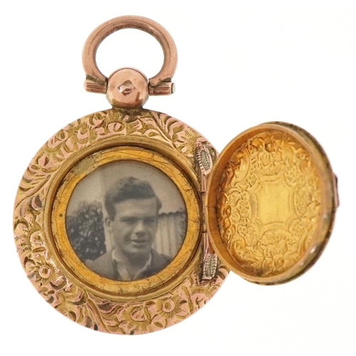 3220 - A Victorian floral engraved yellow metal locket, 3.3cm high, 5.4g.