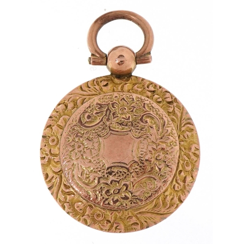 3220 - A Victorian floral engraved yellow metal locket, 3.3cm high, 5.4g.