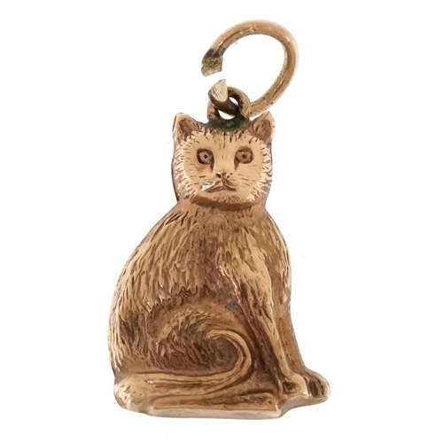 3088 - A 9ct gold charm in the form of a seated cat, 1.9cm high, 0.9g.