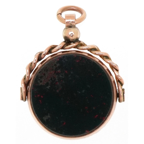 3213 - A Victorian 9ct rose gold carnelian and bloodstone spinner fob, Birmingham 1897, 3.0cm high, 8.4g.