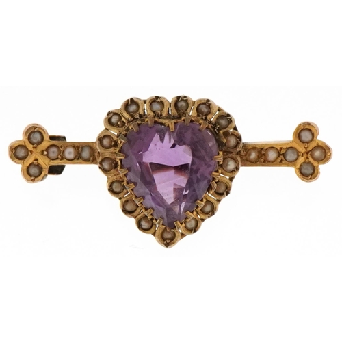 3047 - An antique unmarked gold amethyst and seed pearl love heart bar brooch, 3.8cm wide, 5.0g.