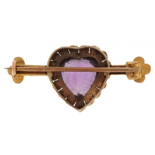 3047 - An antique unmarked gold amethyst and seed pearl love heart bar brooch, 3.8cm wide, 5.0g.