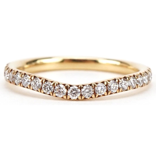 3050 - An 18ct gold diamond engagement ring and half eternity ring, the cushion cut diamond approximately 0... 