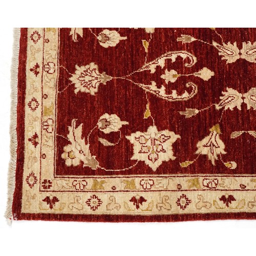 2009 - An Iranian Mashhad rug, 20th century, with allover flower head design within a complementary border,... 