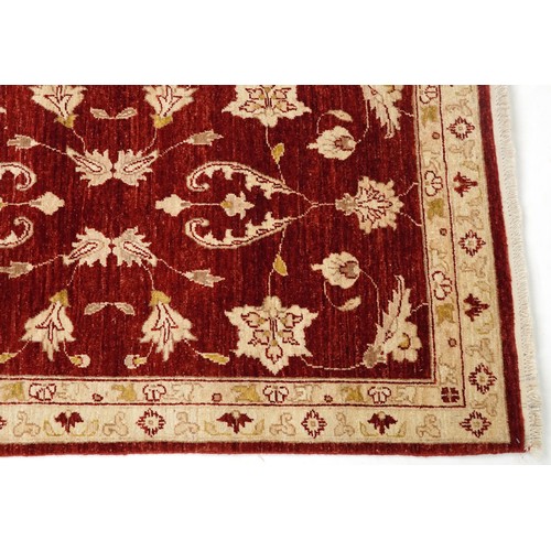 2009 - An Iranian Mashhad rug, 20th century, with allover flower head design within a complementary border,... 