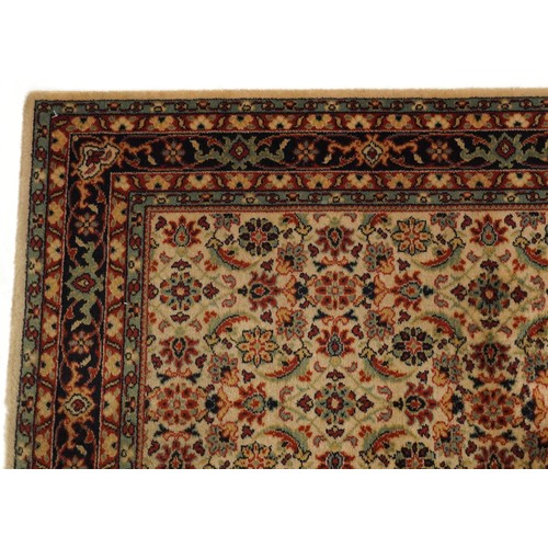 2007 - An Afghan Ziegler rug, late 20th century, the red field with stylized flower head design within a co... 