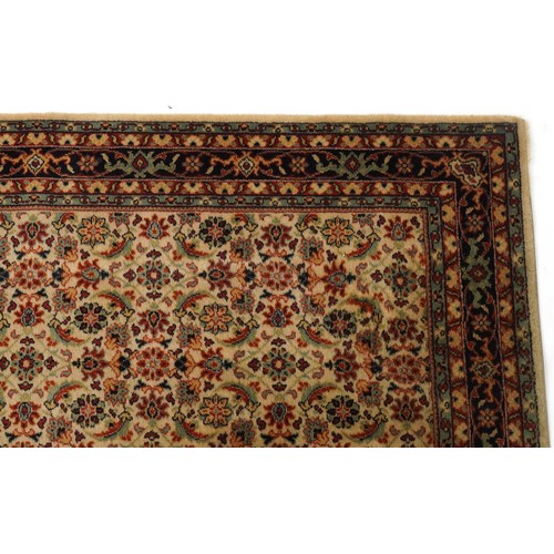 2007 - An Afghan Ziegler rug, late 20th century, the red field with stylized flower head design within a co... 