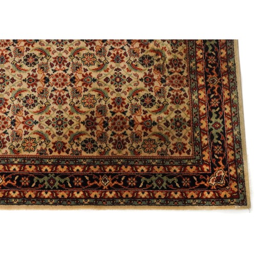 2007 - An Afghan Ziegler rug, late 20th century, the red field with stylized flower head design within a co... 