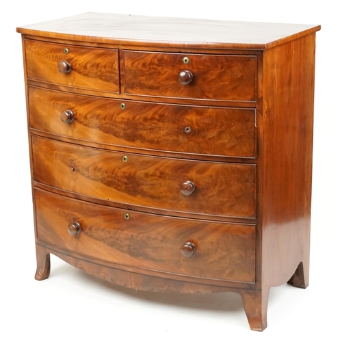 An early Victorian figured mahogany bow front chest of two short and three graduated long drawers on splayed bracket feet, 108cm H x 109cm W x 58cm D.