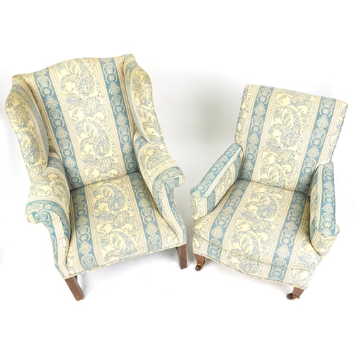 2038 - A late 20th century wingback armchair upholstered in a floral fabric, 103cm high, together with a si... 