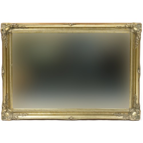 2016 - A late 20th century gilt framed rectangular wall mirror, 76cm x 108cm, together with a 20th century ... 