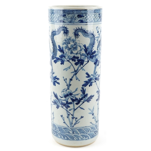 33 - A Chinese blue and white porcelain cylindrical stick stand, late 19th/early 20th century, decorated ... 