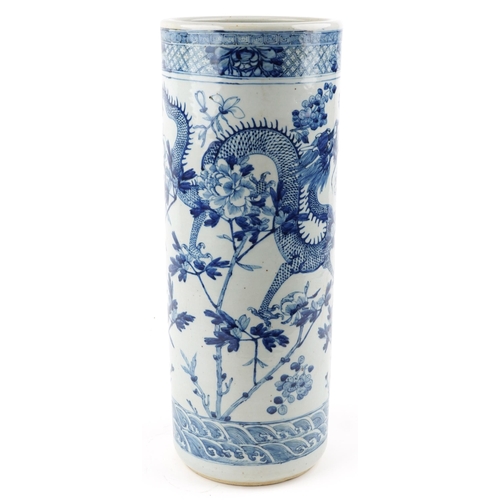 33 - A Chinese blue and white porcelain cylindrical stick stand, late 19th/early 20th century, decorated ... 