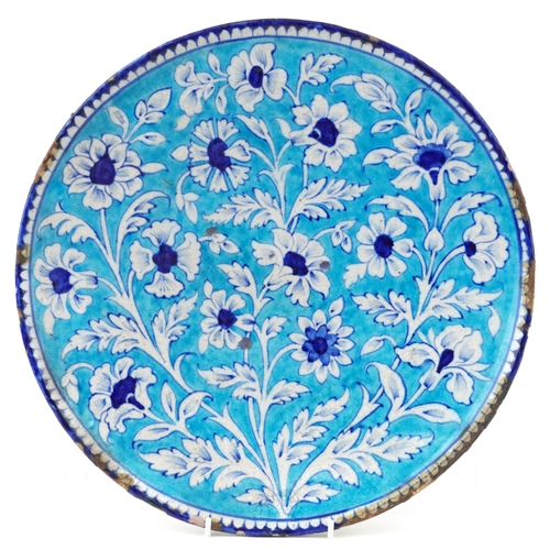 1161 - A large Indian Sind pottery dish, late 19th century, with under glaze hand painted decoration, 37cm ... 