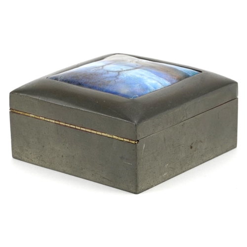 10 - A Liberty & Co. pewter and enamelled square jewellery box, the top decorated with a landscape, indis... 