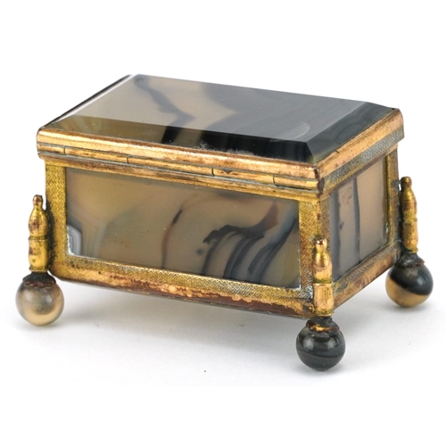 125 - A late 19th century French agate and ormolu mounted diminutive casket, with hinged lid, raised on ba... 