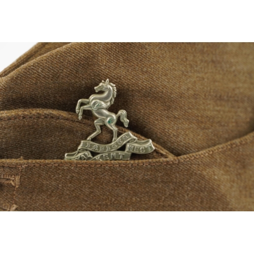 2477 - A British military World War II side cap with Royal Kent West cap badge, stamped marks to the interi... 