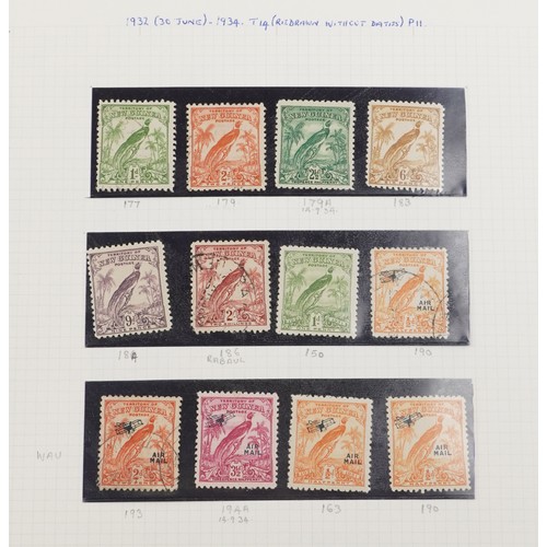 2219 - Red stamp album containing Papua and New Guinea stamps, a good selection of mint and used, to includ... 