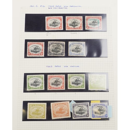 2219 - Red stamp album containing Papua and New Guinea stamps, a good selection of mint and used, to includ... 