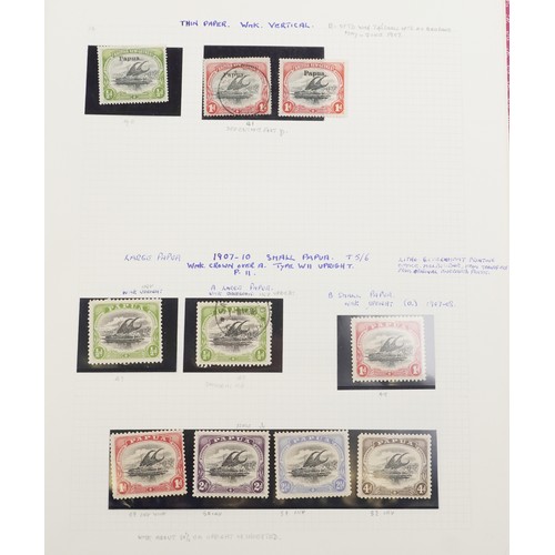 2219 - Red stamp album containing Papua and New Guinea stamps, a good selection of mint and used, to includ... 