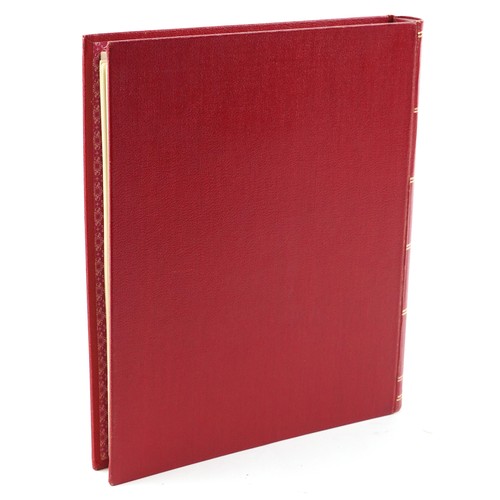 2219 - Red stamp album containing Papua and New Guinea stamps, a good selection of mint and used, to includ... 