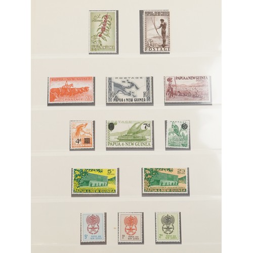 2220 - Papua and New Guinea stamps arranged in two albums dating from 1952 to 1990, mint and used.