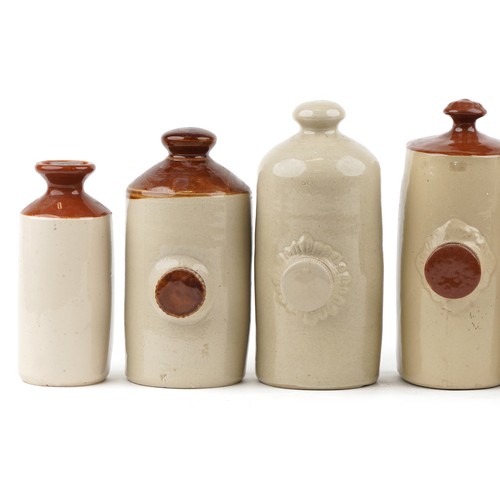 1144 - A group of six late 19th/early 20th century stoneware hot water bottles, variously sized.