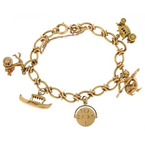 3019 - A 9ct gold charm bracelet with five 9ct gold charms including coronation coach, a Zulu warrior and I... 