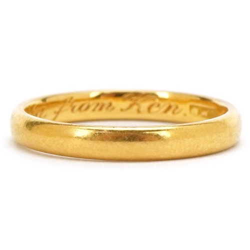 3147 - A 22ct gold wedding band with engraved inscription, London 1958, size N, 3.5g.