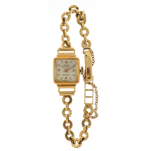 3044 - Orlux, a ladies 18ct gold cased manual wind wristwatch with 9ct gold strap, the case 16mm wide, tota... 