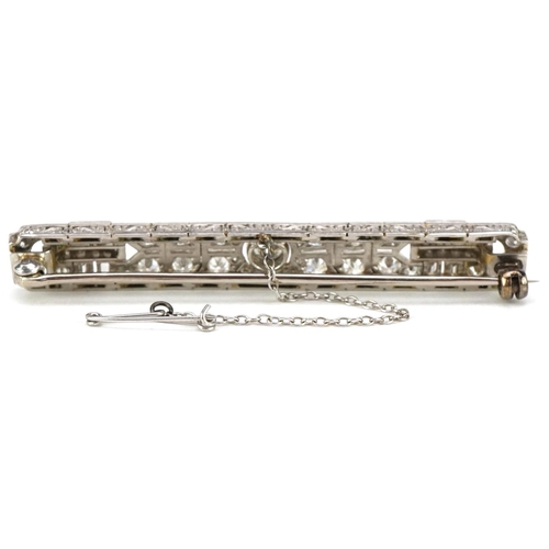 3001 - A good Art Deco unmarked white gold/platinum diamond bar brooch, the central diamond approximately 0... 