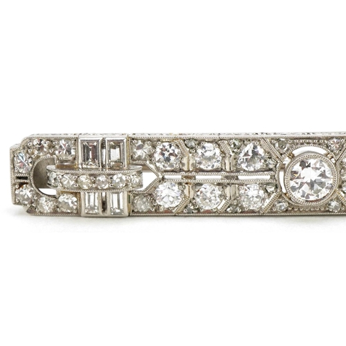 3001 - A good Art Deco unmarked white gold/platinum diamond bar brooch, the central diamond approximately 0... 