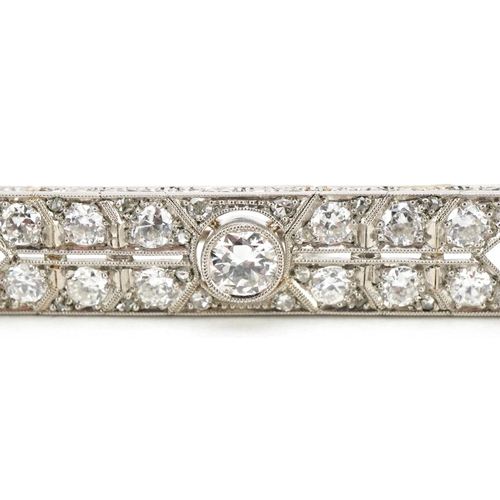 3001 - A good Art Deco unmarked white gold/platinum diamond bar brooch, the central diamond approximately 0... 