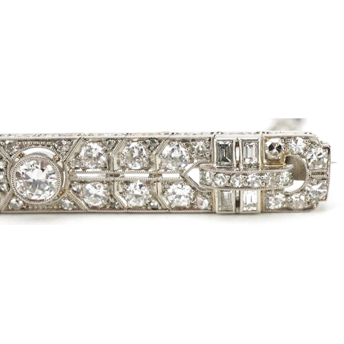 3001 - A good Art Deco unmarked white gold/platinum diamond bar brooch, the central diamond approximately 0... 