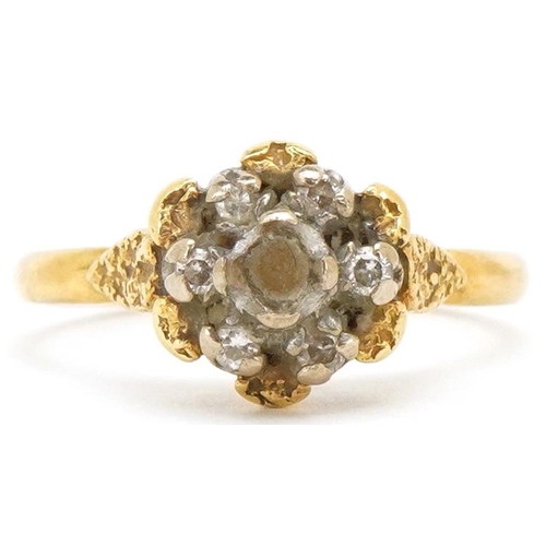 3498 - An 18ct gold diamond flower head ring with ornate setting, size L, 3.6g.