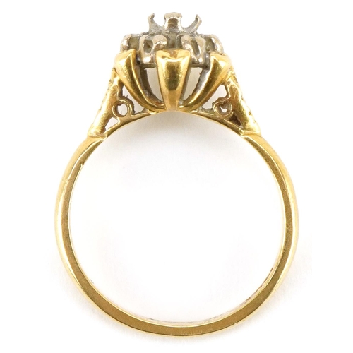 3498 - An 18ct gold diamond flower head ring with ornate setting, size L, 3.6g.