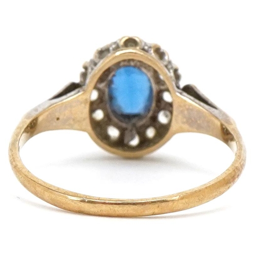 3214 - A 9ct gold blue spinel and clear stone cluster ring, size R, 2.4g.