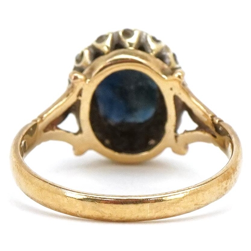 3163 - A 9ct gold sapphire and diamond cluster ring, size P, 3.9g.