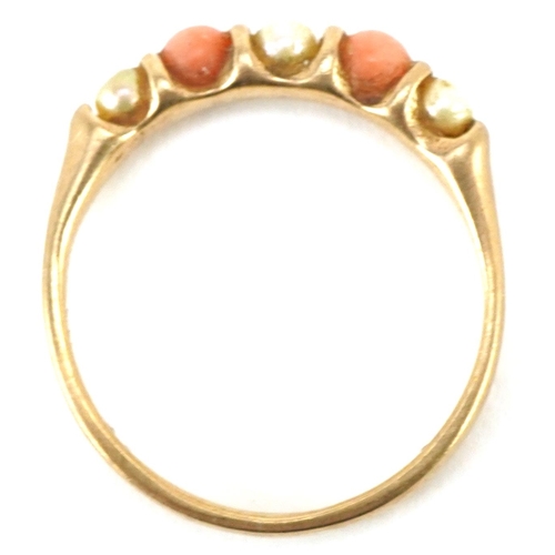 3495 - A 9ct gold coral and seed pearl half eternity ring, size I, 1.4g.