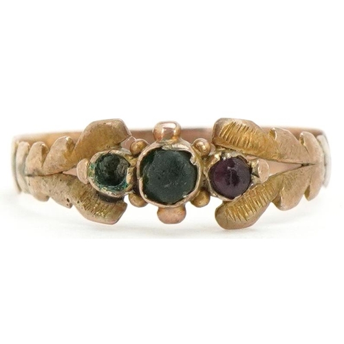 3492 - An antique unmarked gold green and purple stone ring, with leaf design setting, size K, 0.8g.