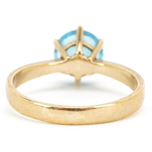 3179 - A 9ct gold blue topaz solitaire ring, the topaz approximately 9.25mm in diameter, size W, 4.6g.