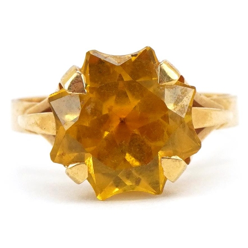 3202 - A continental gold star cut yellow stone ring (tests as sapphire), the stone 12.10mm x 12.10mm, size... 