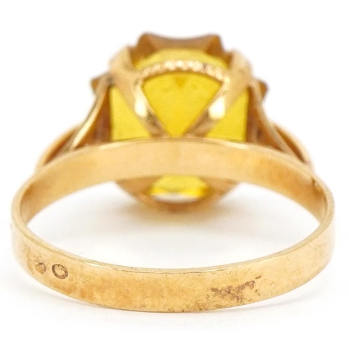 3202 - A continental gold star cut yellow stone ring (tests as sapphire), the stone 12.10mm x 12.10mm, size... 