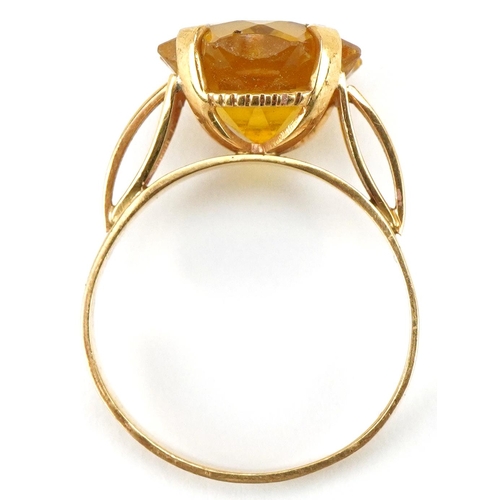 3202 - A continental gold star cut yellow stone ring (tests as sapphire), the stone 12.10mm x 12.10mm, size... 