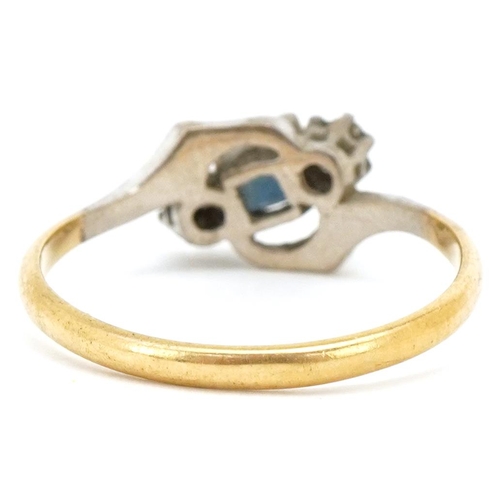 3486 - An 18ct gold diamond and sapphire crossover ring, size N, 2.5g.