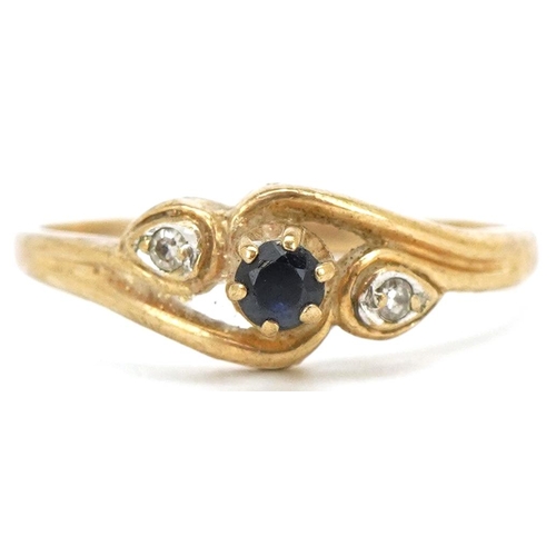 3481 - A 9ct gold diamond and sapphire three stone crossover ring, size J/K, 1.4g.