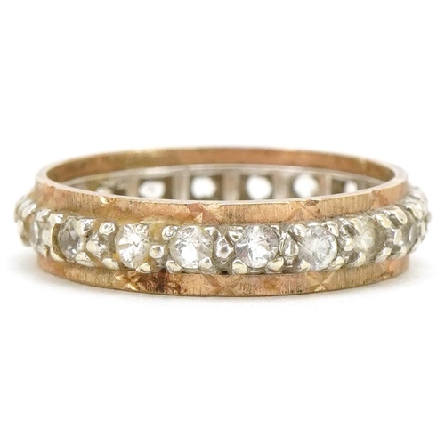 3480 - A 9ct two tone gold clear stone eternity ring, size M, 2.6g.