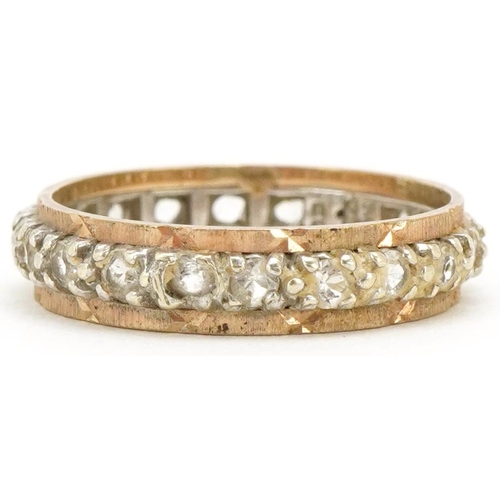 3480 - A 9ct two tone gold clear stone eternity ring, size M, 2.6g.